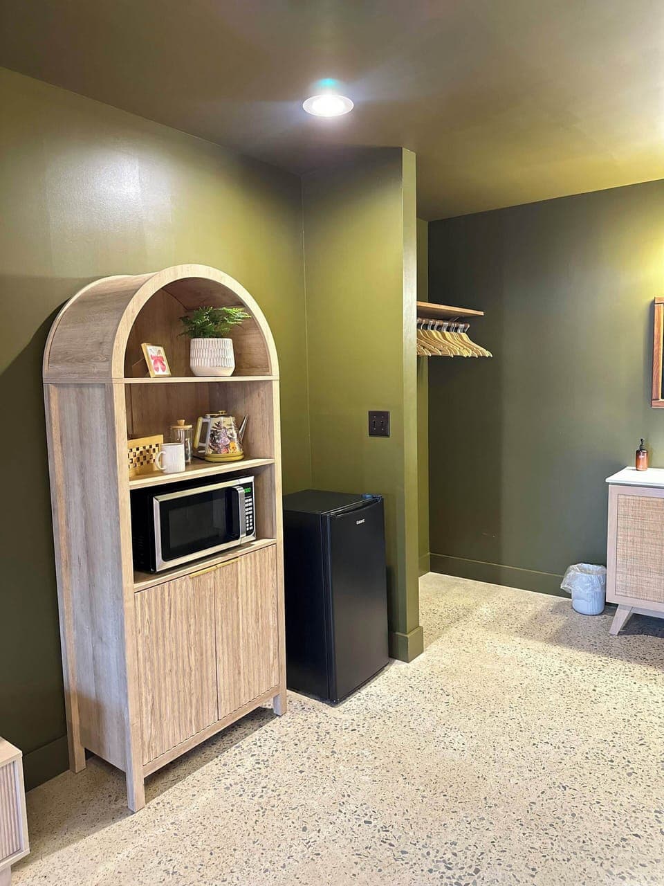 Microwave, mini fridge, french press, hot water kettle, local coffee and tea.