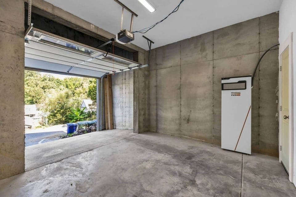 Left garage bay fits a sedan or mid-size SUV.