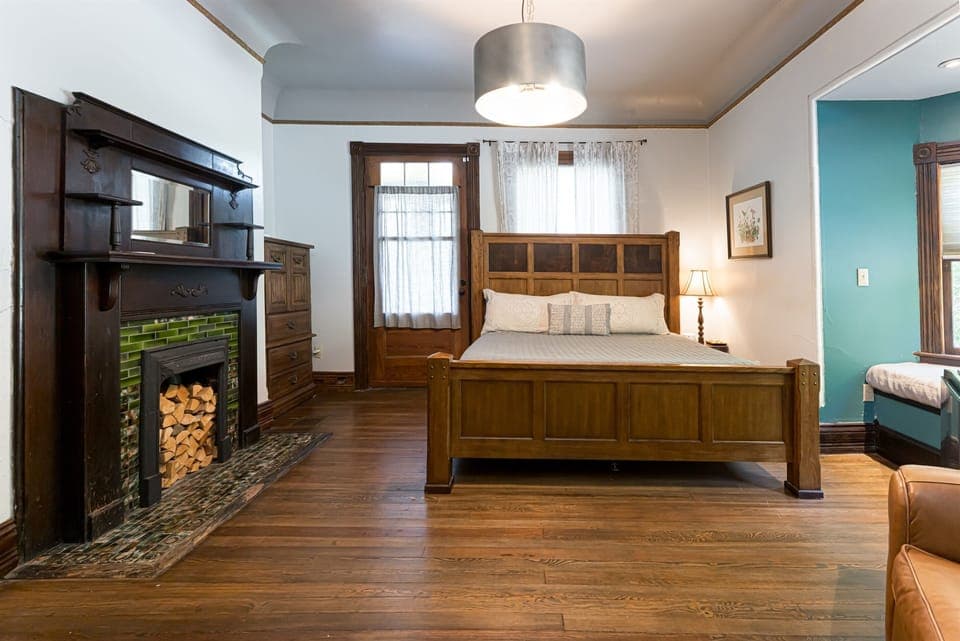 Bedroom on the ground/first floor (with a king bed) with a connected full bathroom.