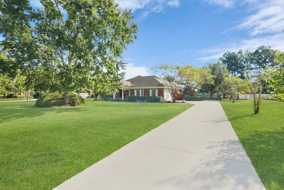 .75 acre lot with mature trees.  Driveway will fit 3-4 cars comfortably.