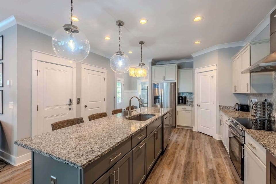Contemporary kitchen with all appliances and a stylish island with bar seating.
