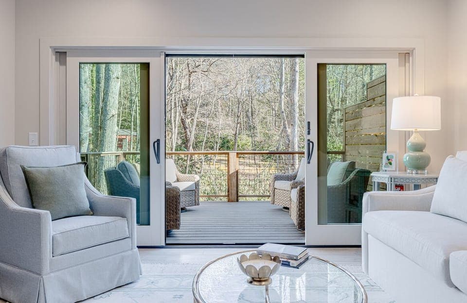 Family Room off Kitchen, with an 8 Foot Sleeper Sofa & a pair of Swivel Chairs 