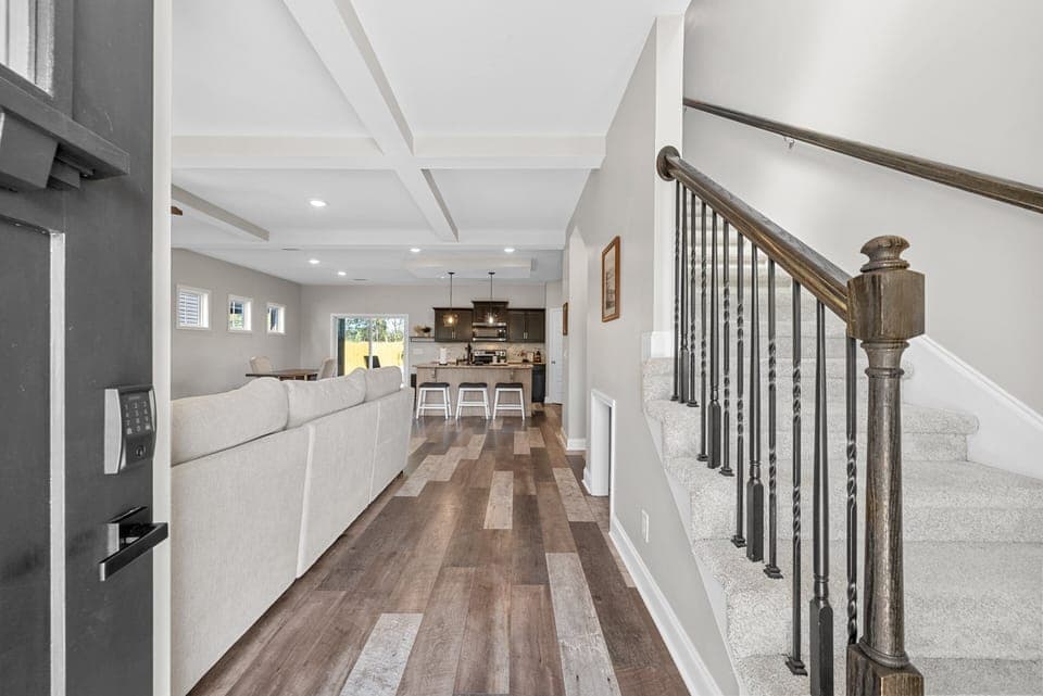 Spacious open-concept living and dining area with modern finishes