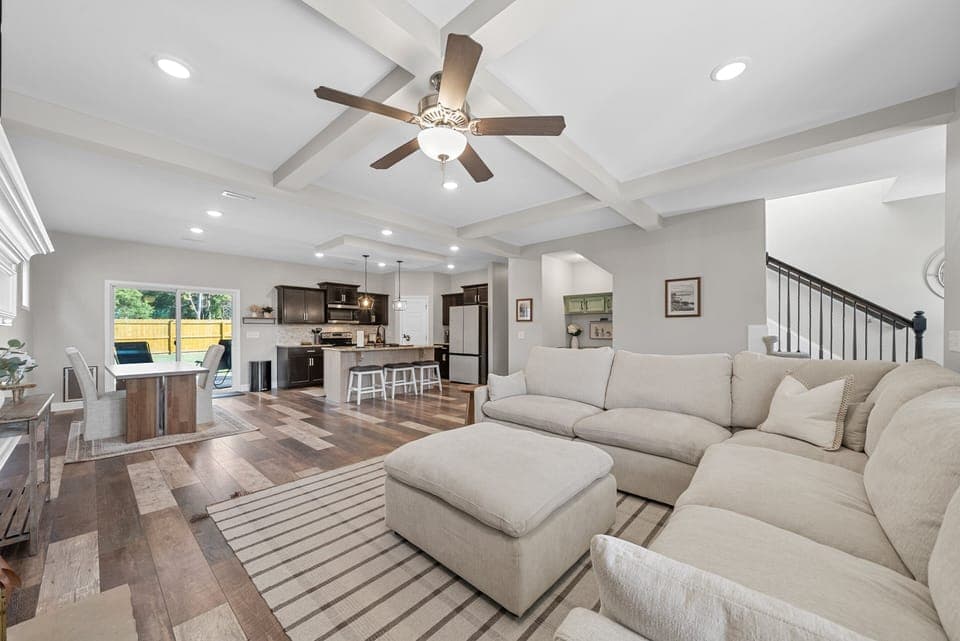 Combined living and kitchen area featuring ample seating and natural light