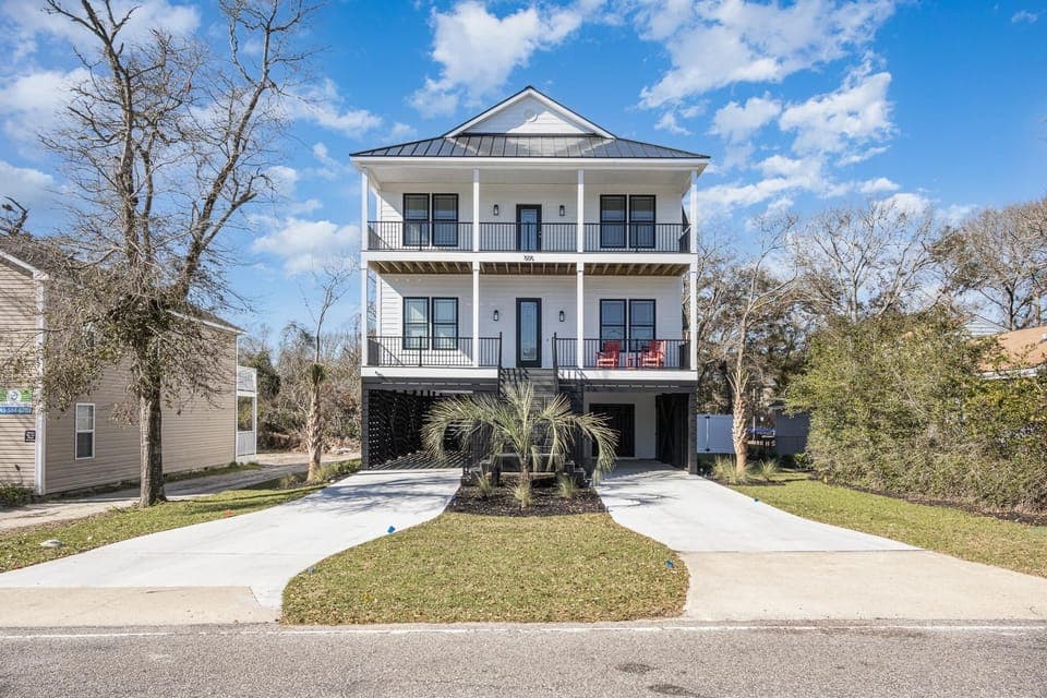Spacious three-story home with dual balconies and ample parking