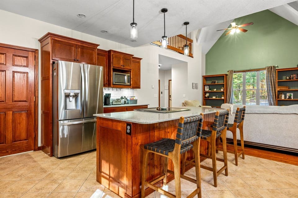 Our kitchen is well-appointed with quality cookware and utensils, making it easy to prepare family meals while everyone relaxes at the spacious island.