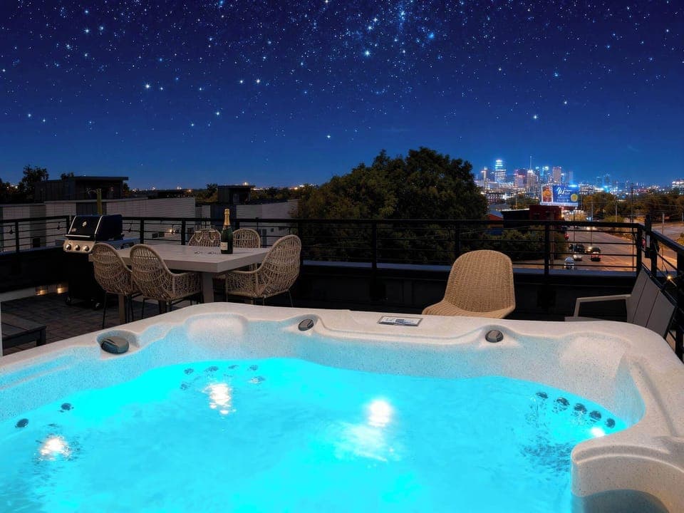 Unwind under the stars in this stunning rooftop oasis featuring a hot tub and breathtaking downtown views. Perfect for Nashville group vacations or bachelorette parties, reserve your stay today with Misfit Homes and elevate your getaway!