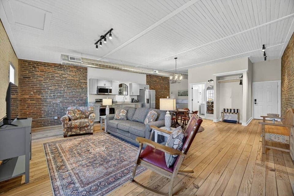Relax in this cozy living room and watch your favorite show. Enjoy the view as you rock by the window. The 4K Smart TV has all your favorite streaming services pre-downloaded. Bring your own login.