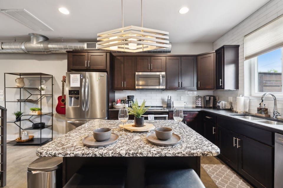 Kitchen: Whip up meals with ease—spacious counters and a central island made for cooking and conversation."