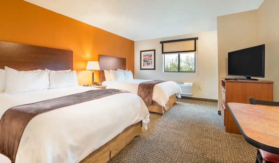 Settle into a spacious double-queen room with relaxing views.