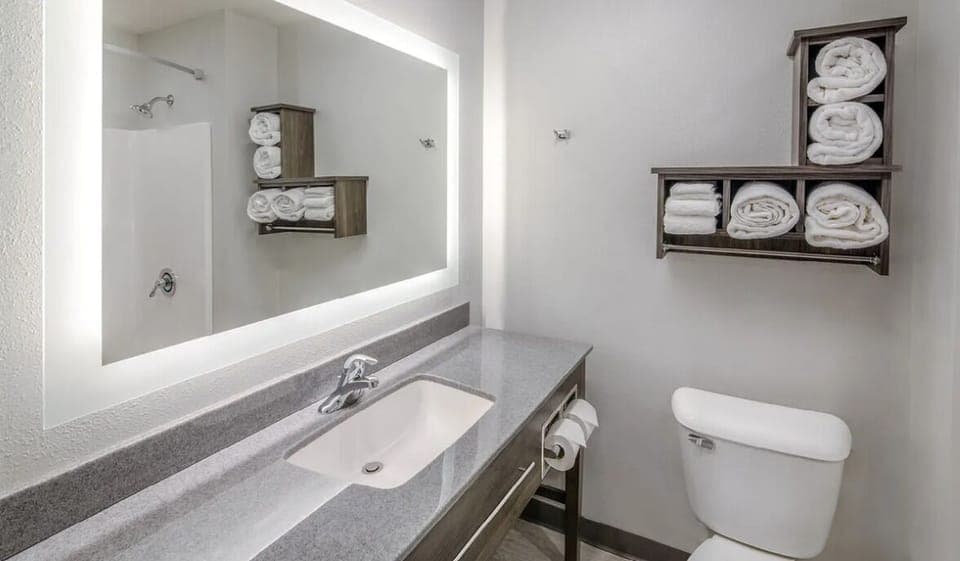 Refresh easily with a bright vanity and neatly stocked towels