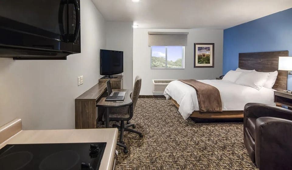 Unwind in a bright king room with kitchenette convenience