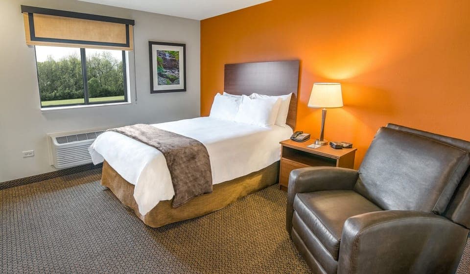 Sink into a cozy king bed beside a lounge-worthy armchair.