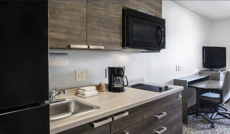 Cook simply and comfortably with streamlined counters and modern cabinetry