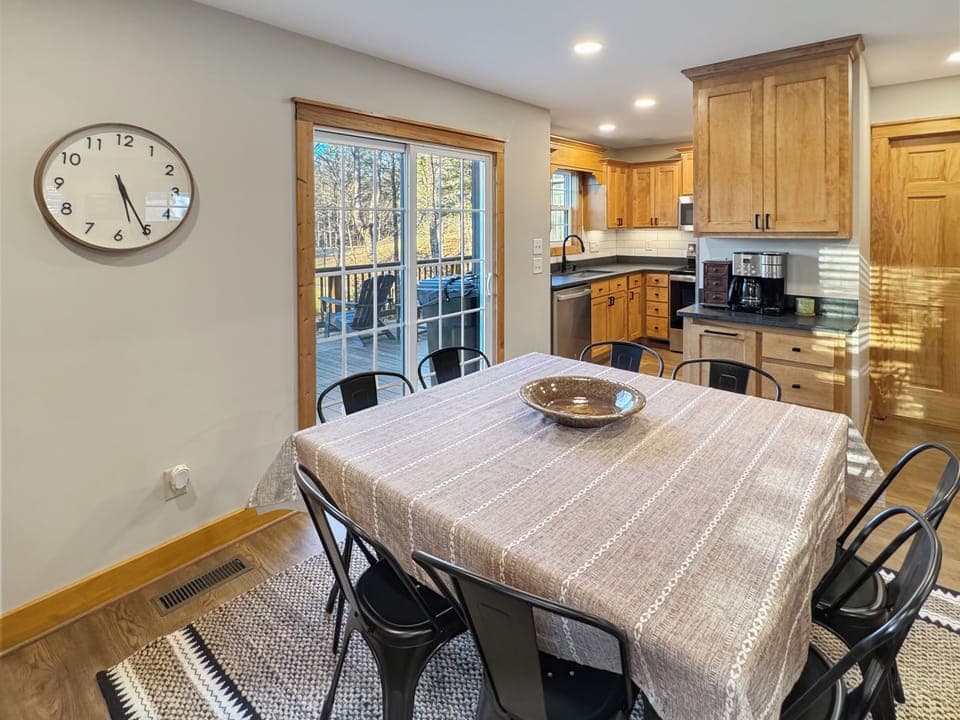 Gather for family meals in our bright dining space with woodland views.