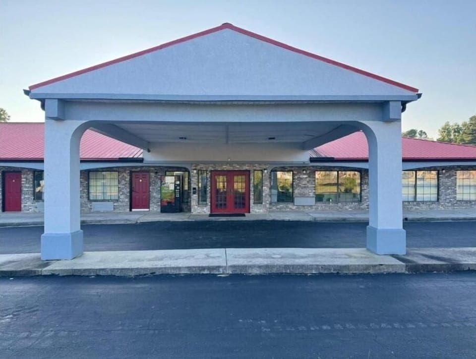 Pull up under the covered entrance for a simple arrival.