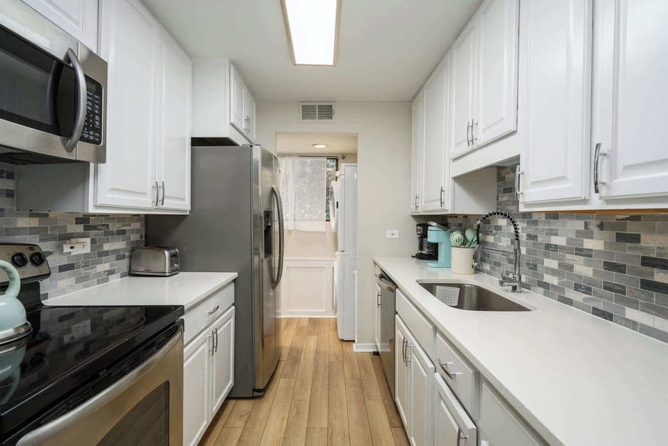 Bright modern kitchen with stainless steel appliances 