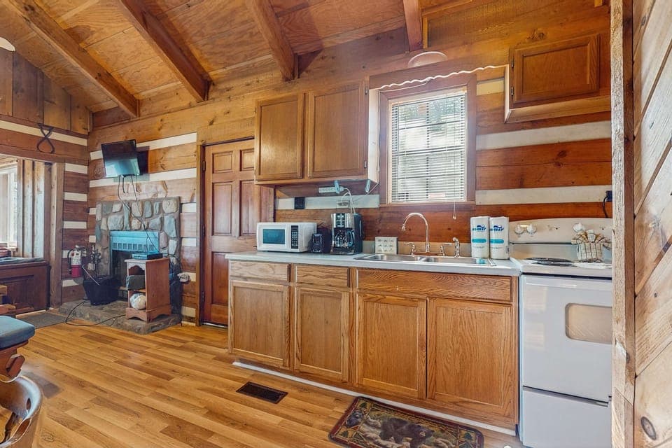 Rustic charm with a modern twist—prepare meals surrounded by wooden elegance!