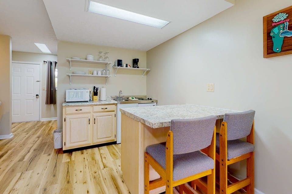 Ideal setup for meals or remote work, featuring a bright, inviting atmosphere!