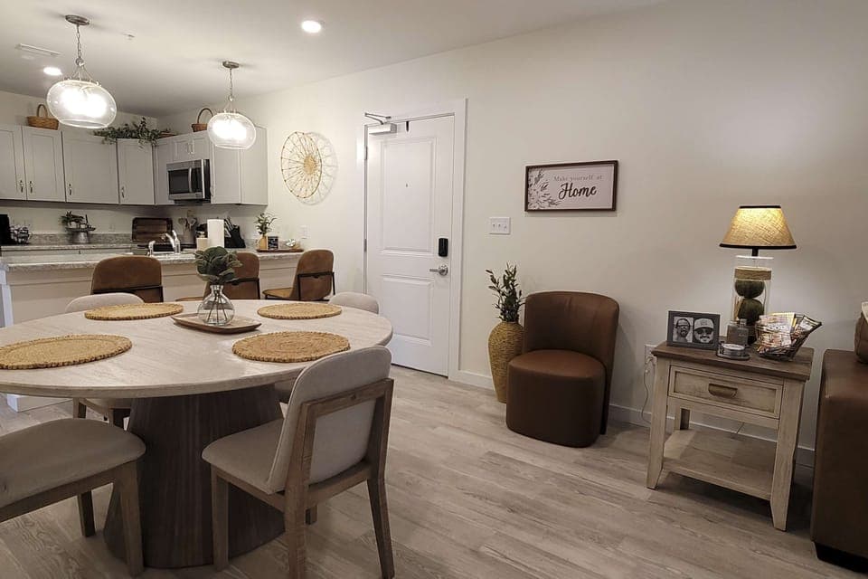 Gather around the stylish table and enjoy delightful meals in this inviting space!