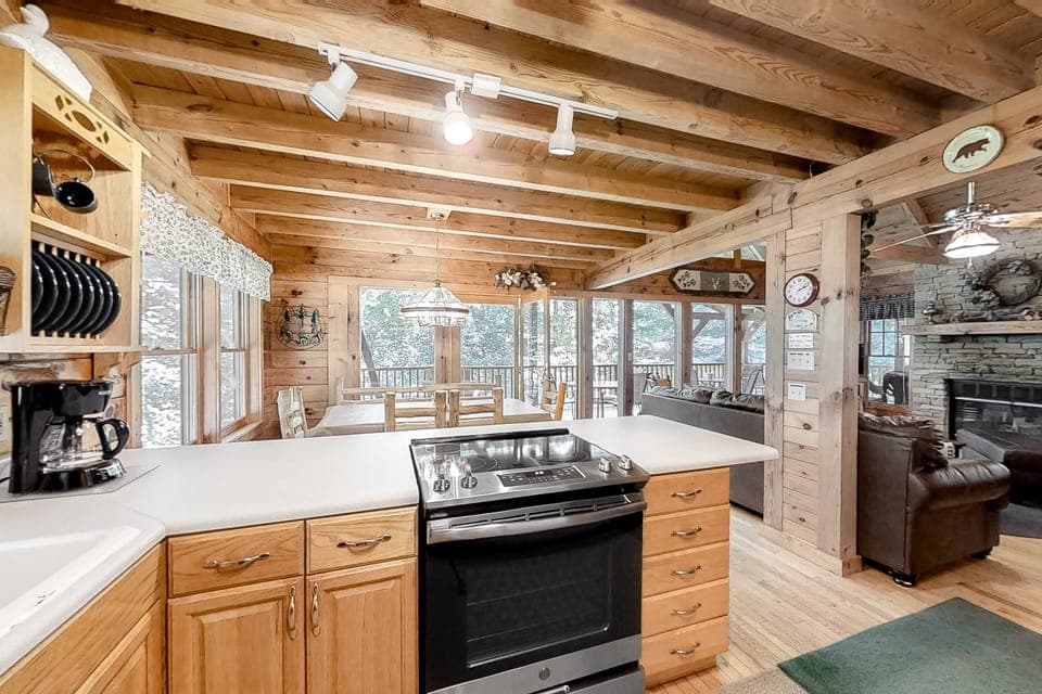 Open space fills with natural light, featuring rustic decor and scenic views!