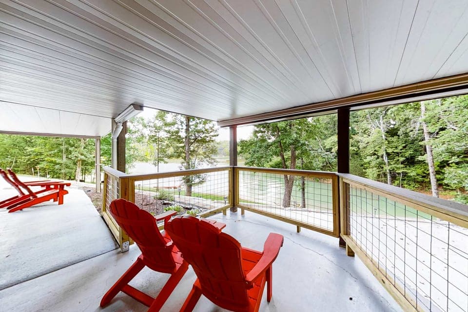 Your porch escape awaits. And, relax in vibrant Adirondack chairs with stunning river views and lush greenery!