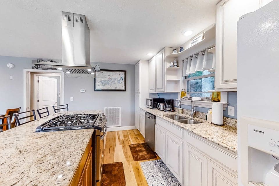 Whip up culinary delights in this airy, modern space with stunning granite counters!