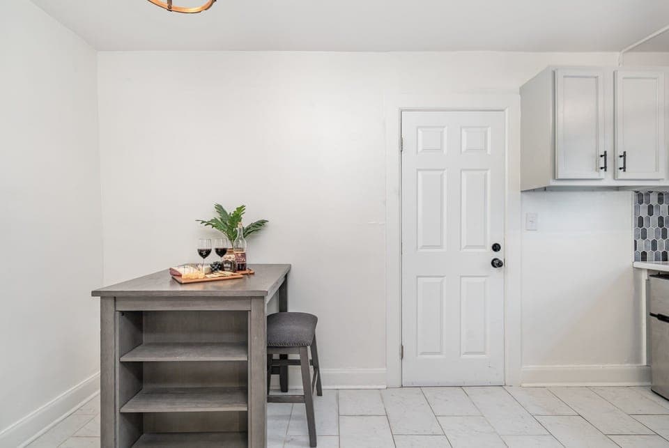 Unit 1: Essentially equipped kitchen, complete with stainless-steel appliances and a dining area for 2 guests.