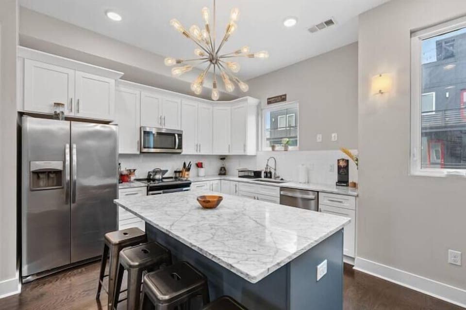 Kitchen: A modern kitchen with sleek finishes and updated appliances.