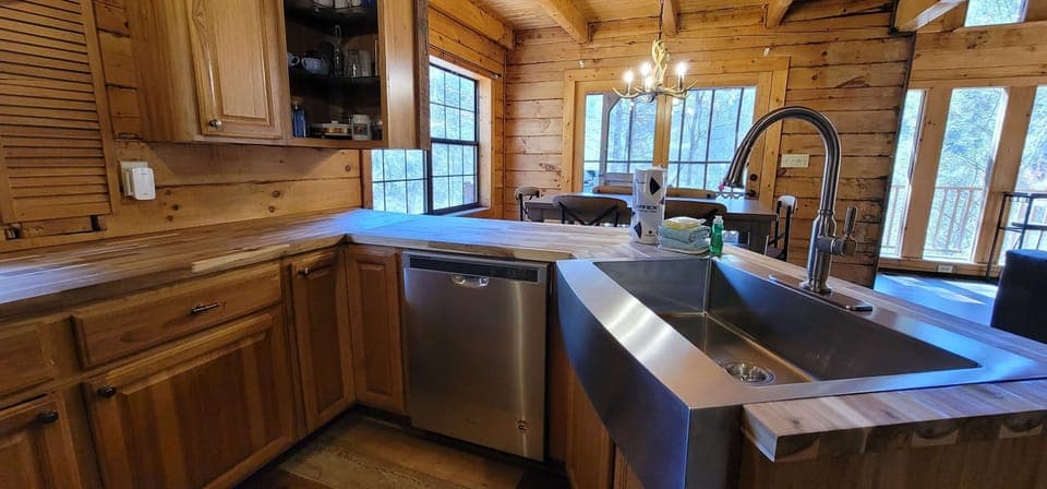 Cook up a feast in this bright, wood-accented kitchen with modern appliances!