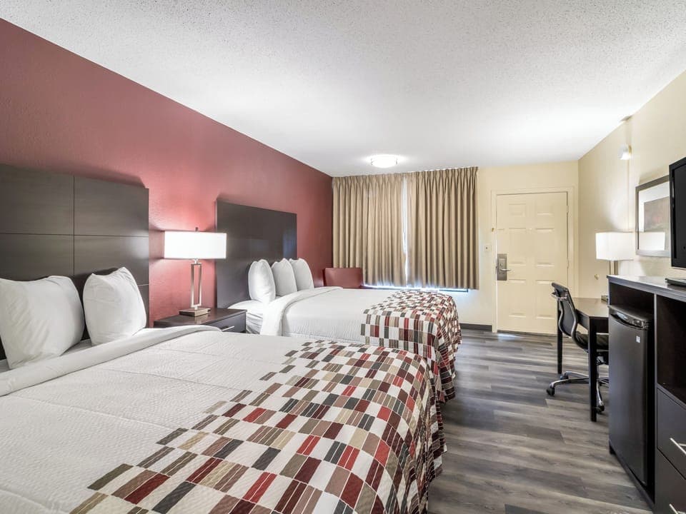 Make yourself at home with workspace convenience and cozy bedding.