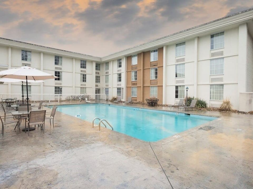 Dive into refreshing courtyard swims with loungers and open skies.