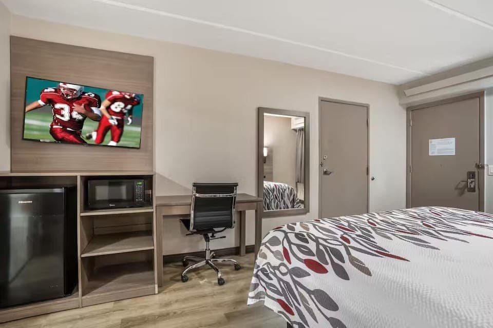 Settle in with a handy desk, microwave, and mini fridge.