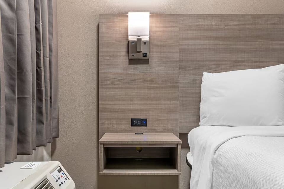 Cool down fast with in-room AC and easy bedside access.