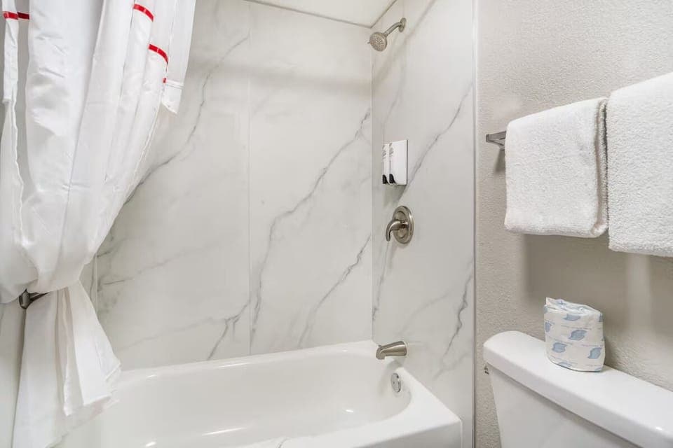 Refresh with a hot shower in a spotless, bright bath.