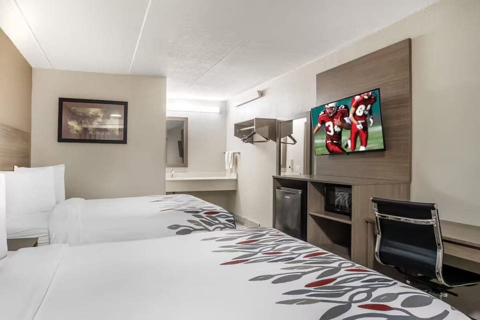 Unwind on crisp linens while streaming shows on HDTV.