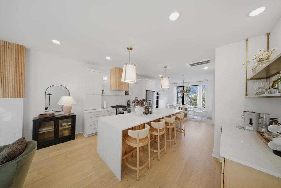 Kitchen: Sleek lines, warm tones, and high-end touches — the perfect kitchen for cooking, entertaining, and enjoying life together.