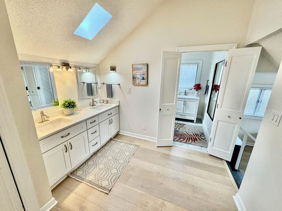 Separate sitting area within master bedroom #1: 2 sinks and 1 sofa bed