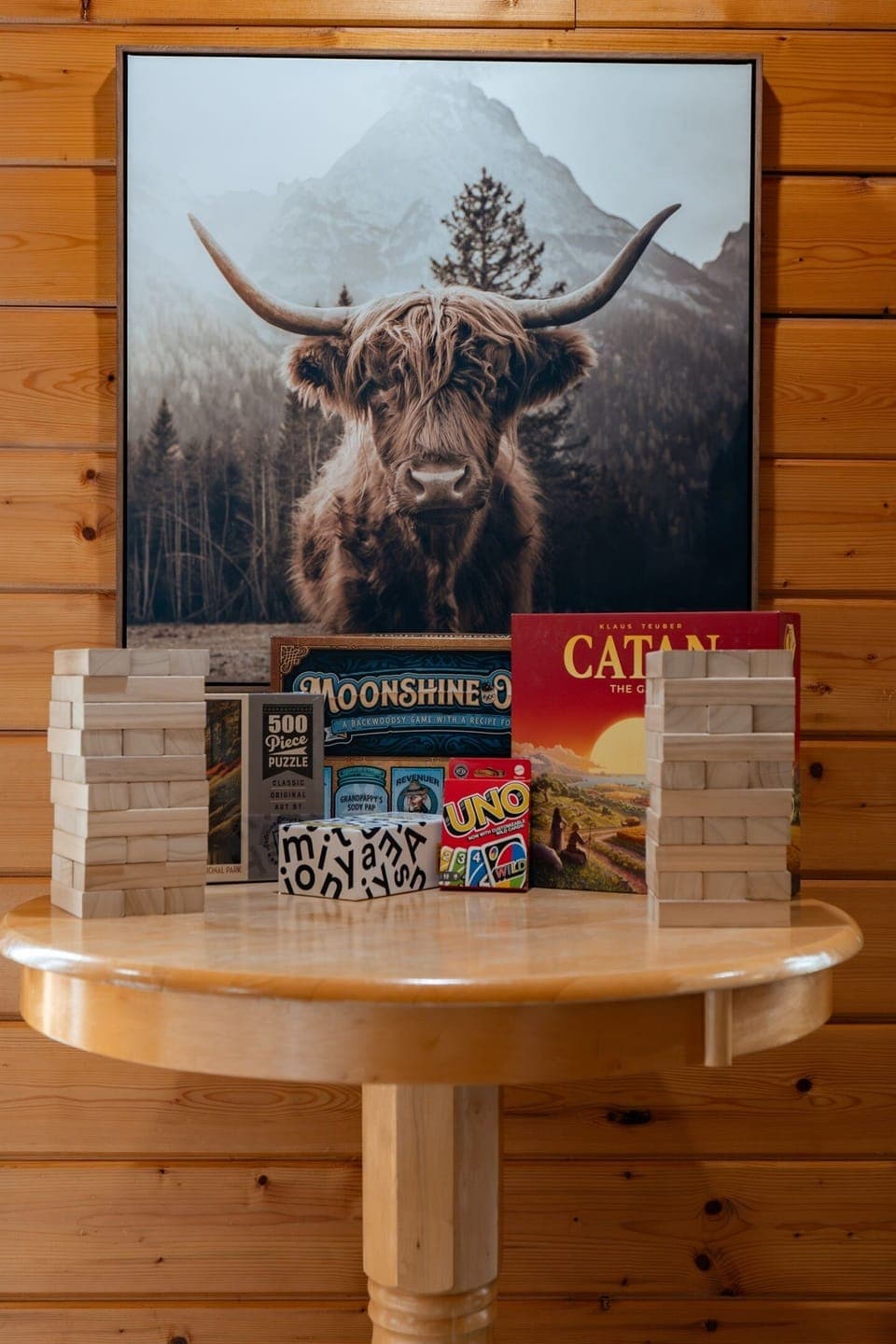 Catan, Jenga, Uno, Moonshine-opoly, a 500-piece puzzle — the game table is stocked and ready for whoever's up for a rematch.