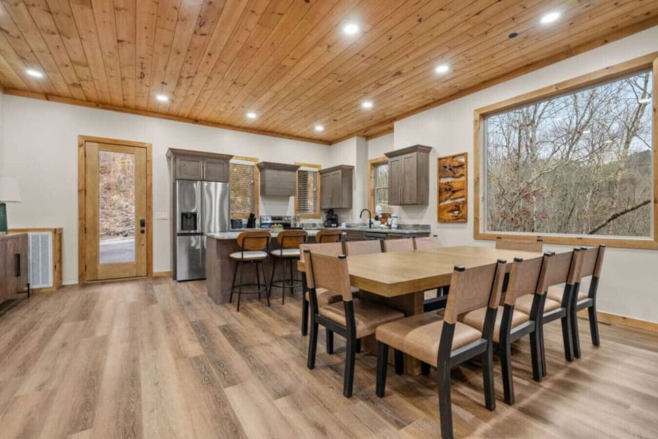 Gather around the oversized dining table for laughter, games, or meals made in the fully equipped kitchen just steps away—perfect for reconnecting after a day of adventure.