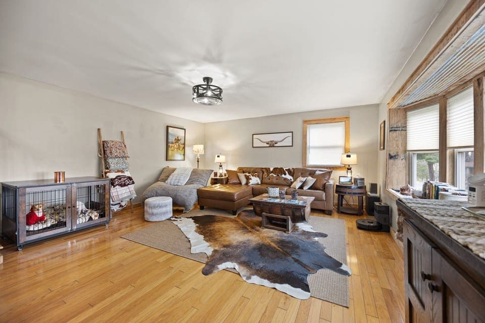 This living room feels inviting, comfortable, and perfect for winding down together. (Dogs in sweaters not included!)