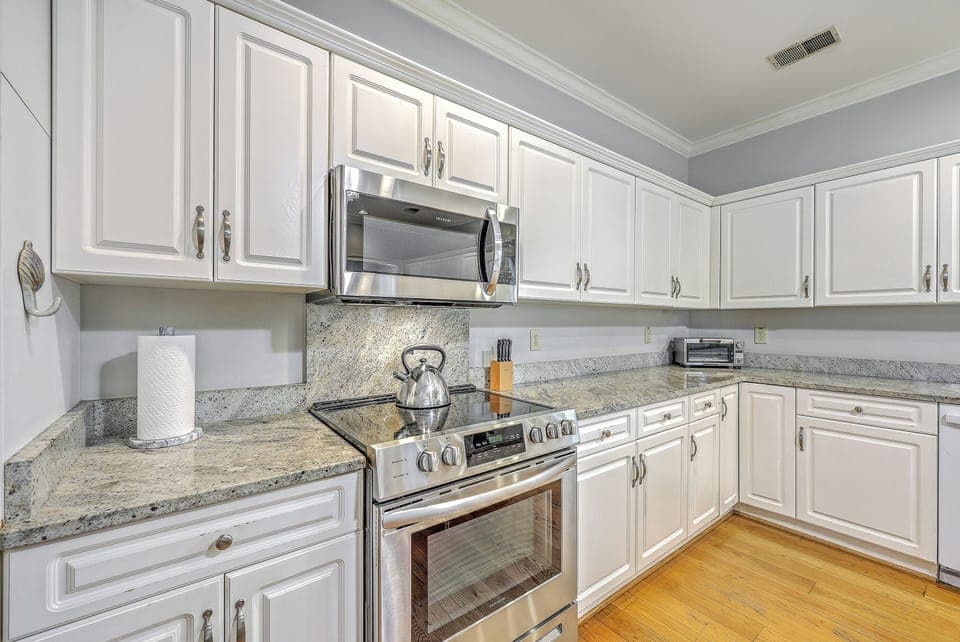 An open-concept kitchen and dining area designed for seamless island entertaining.