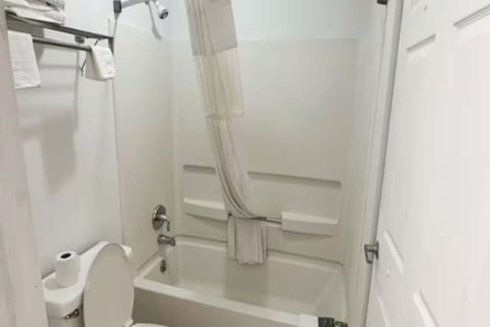 Refresh after exploring in a bright, spotless tub shower.