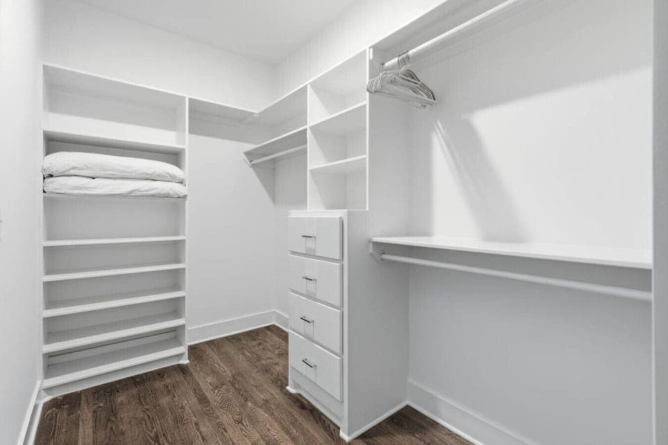 Primary bedroom on the 3rd floor with a king bed, Smart TV, ensuite bath, and room darkening shades.  Includes a large walk-in closet. Tastefully decorated with high-end modern furnishings.
