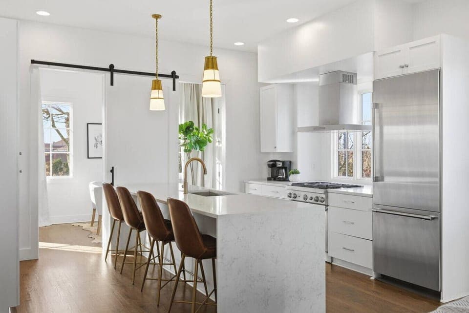 Fully equipped kitchen with stainless steel appliances, seating for 4 at the kitchen island, additional seating at the dining room table and all the dishware / utensils you might need.
