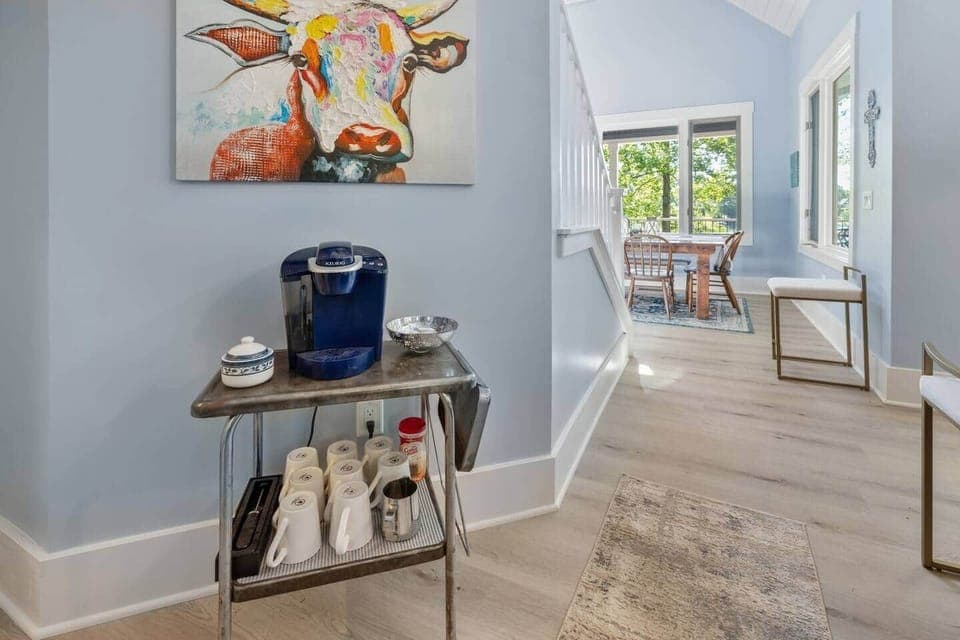 Fully stocked coffee bar with a Keurig maker.