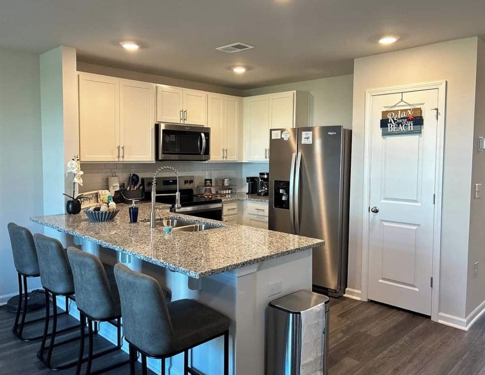 Modern Convenience: Enjoy brand-new stainless steel appliances, including a spacious refrigerator and quiet dishwasher. Ample pantry storage keeps your groceries organized during longer stays.