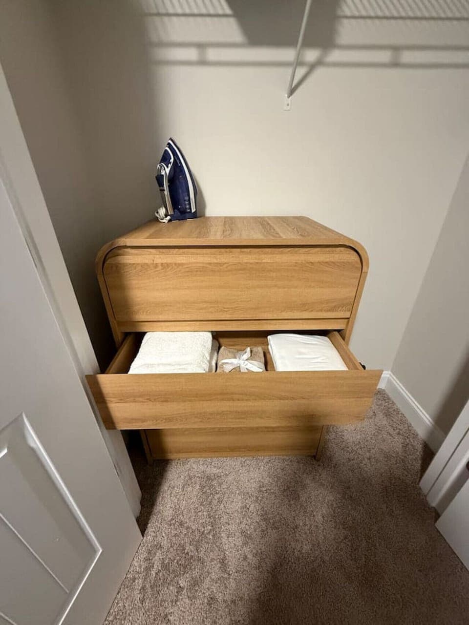 `Find everything you need for a comfortable stay with fresh linens and laundry essentials tucked away in our modern wood dresser.