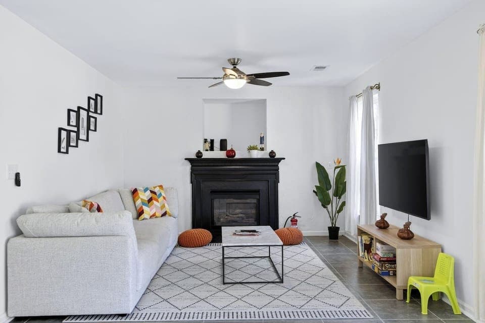 Bright living room perfect for relaxing, watching TV, or gathering.