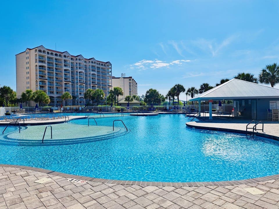 Expansive pool oasis with our building just steps away